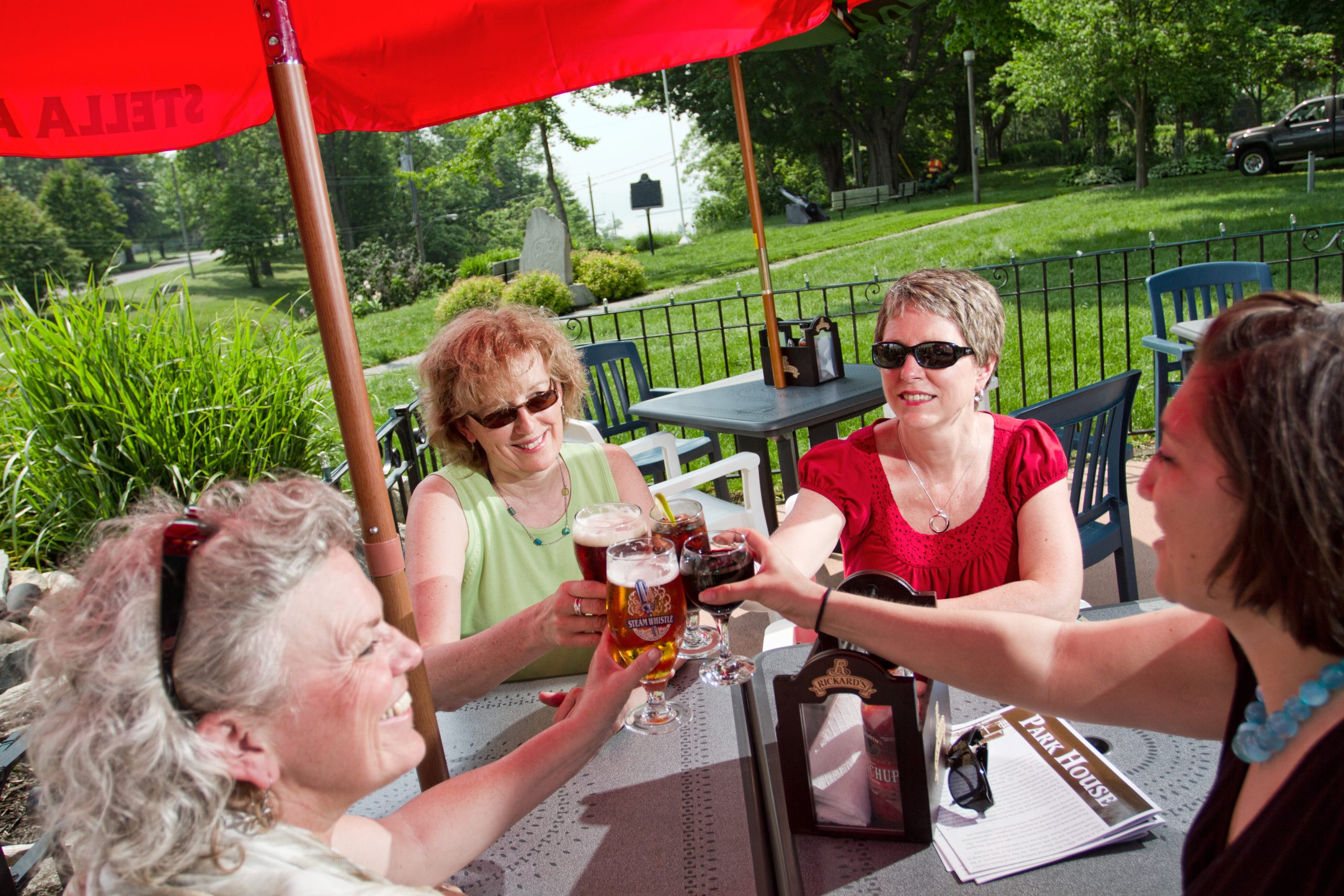 4 women enjoying drinks on a Goderich restaurant patio
